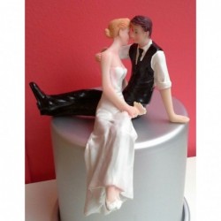 Sitting couple wedding cake...